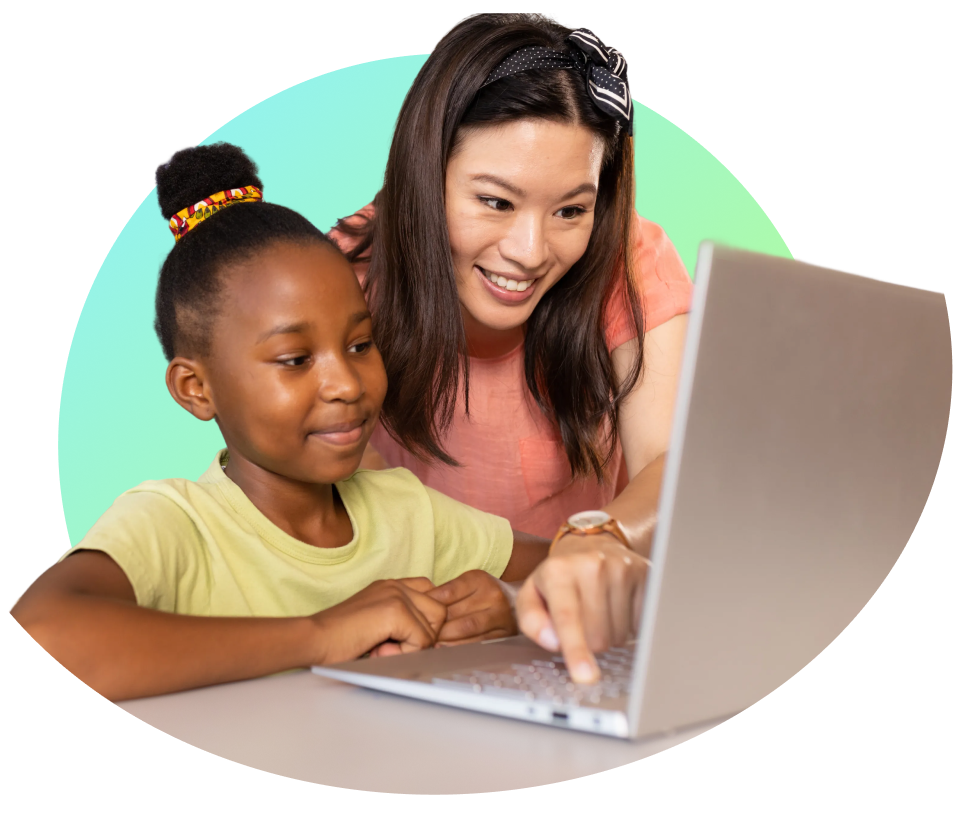 adult and child working on laptop